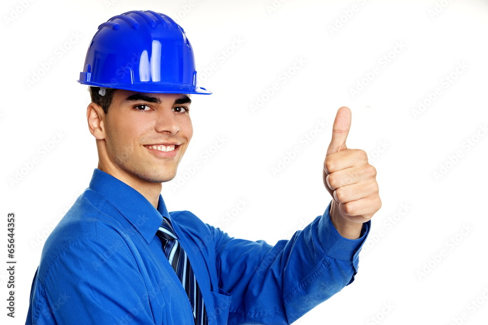 Young businessman in a protective helmet show you thumb up