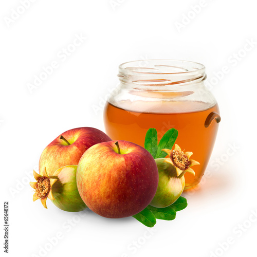 Honey, apple and pomegranate on white background