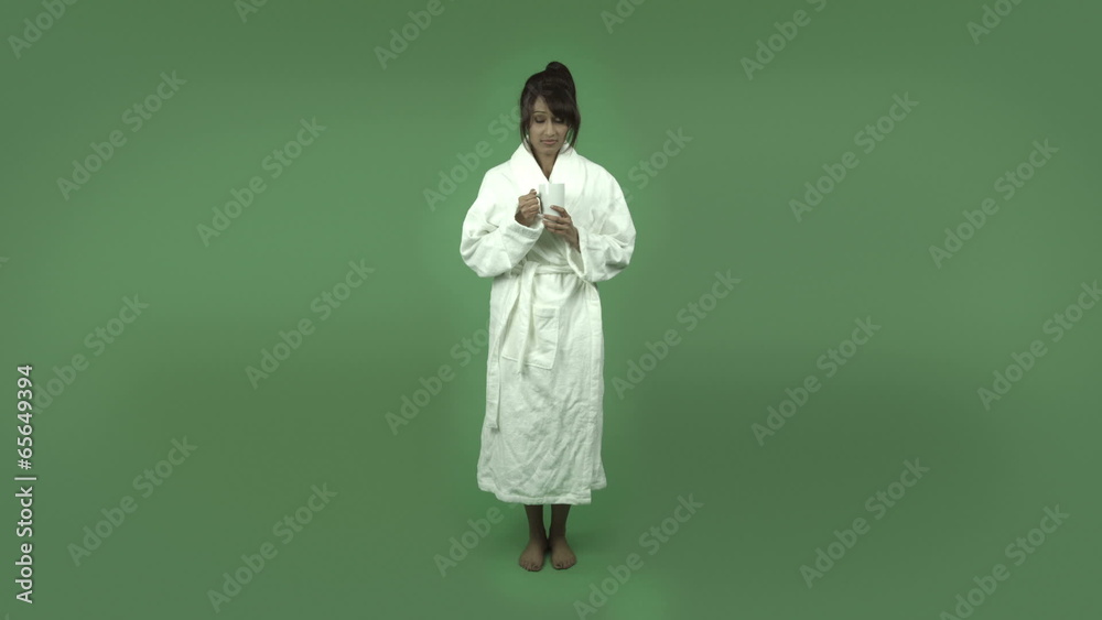 indian woman in bathrobe isolated on green stressed depressed indian woman in bathrobe isolated on green stressed depressed