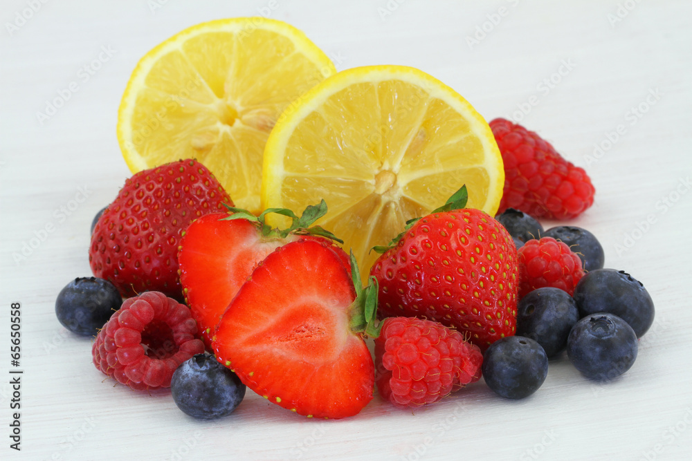 Selection of fresh fruit on white wooden surface Selection of fresh fruit on white wooden surface