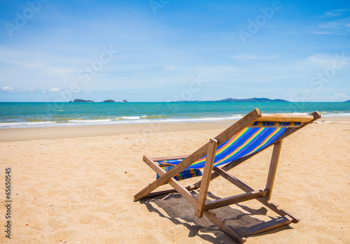 Canvas chair on beach and blue sky