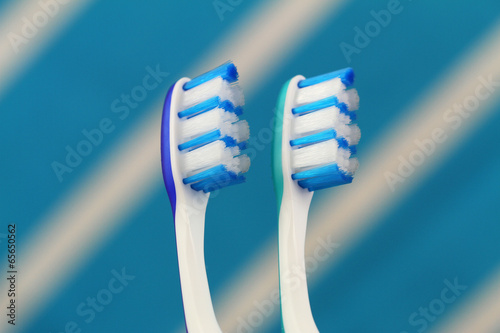 Blue and green toothbrushes