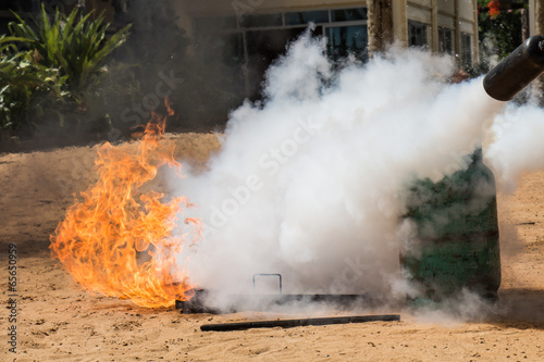 Demonstration of fire caused by gas canisters by fire extinguish