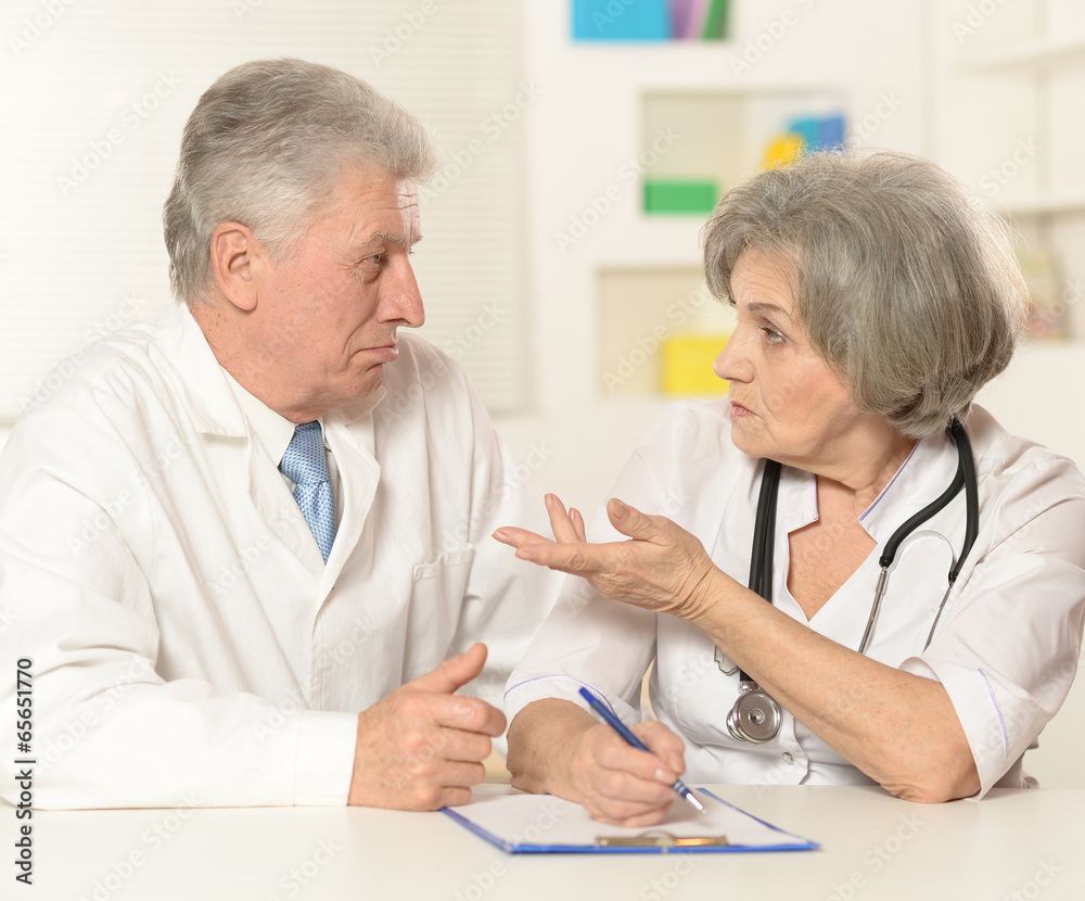 Elderly doctors working Elderly doctors working