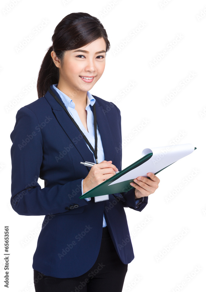 Businesswoman record something on folder Businesswoman record something on folder