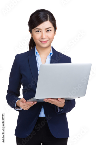 Asian business woman using notebook computer © leungchopan