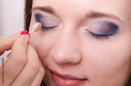 Makeup artist is shaded eyelids model © madhourse