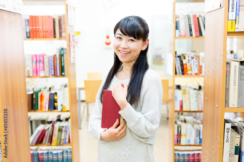 young asian woman in the library
