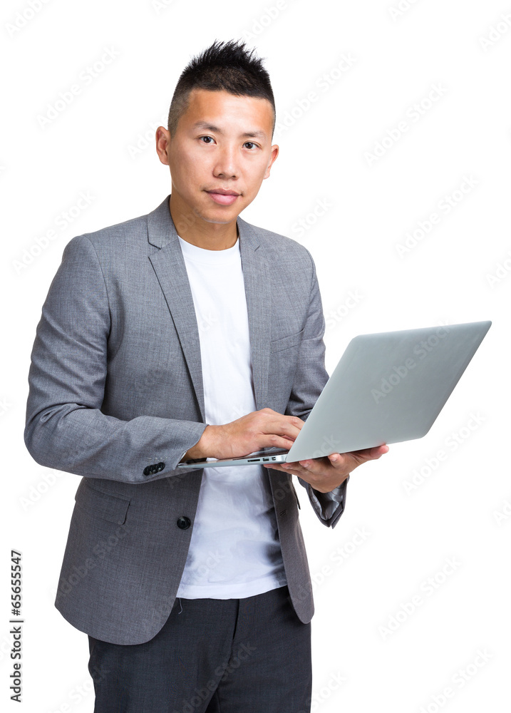 Businessman holding laptop