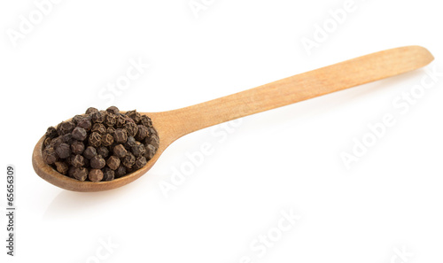 dried dill seeds in spoon on white