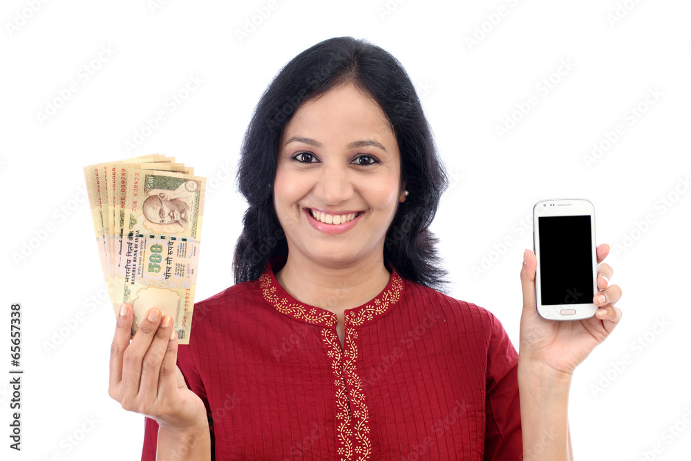 Young woman holding Indian currency and mobile phone Young woman holding Indian currency and mobile phone