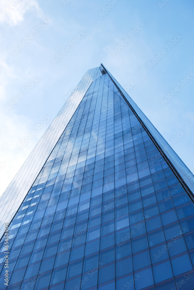 The Shard of Glass London towers into blue sky