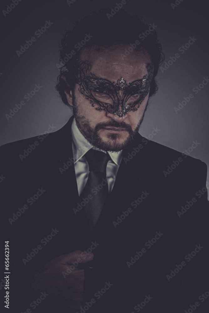 Portrait of elegant businessman, mysterious venetian mask Portrait of elegant businessman, mysterious venetian mask