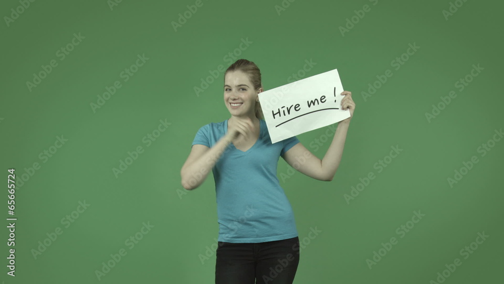 attractive caucasian casual girl isolated on green with hire me attractive caucasian casual girl isolated on green with hire me