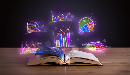 Book on wooden deck with glowing graph illustrations