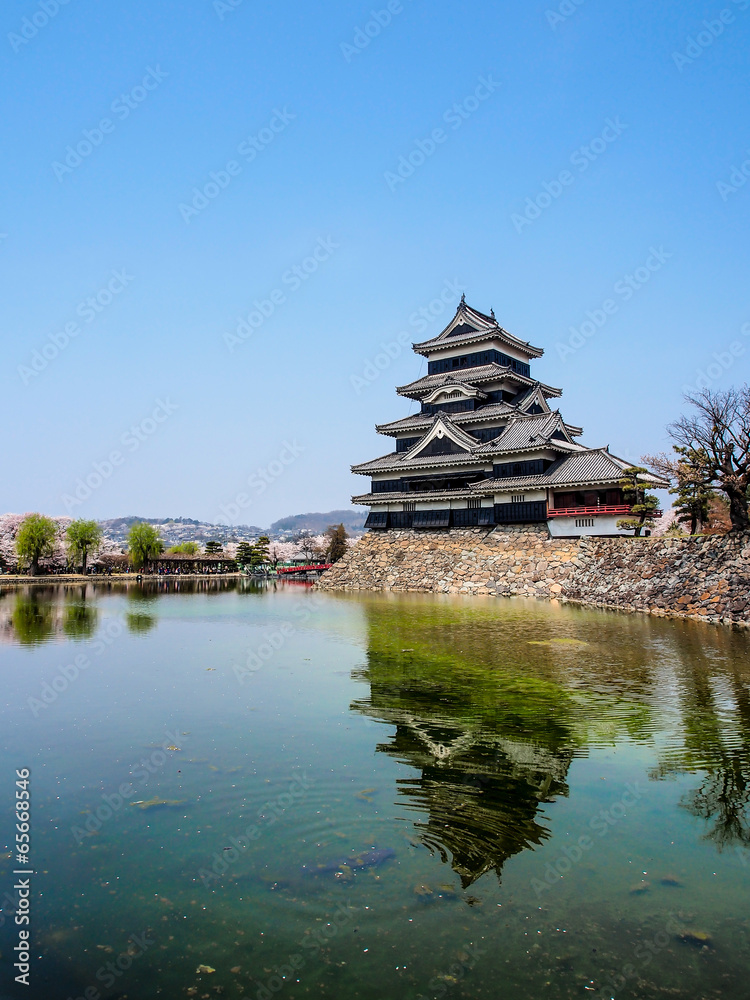 Matsumoto castle with blue sky in spring season Matsumoto castle with blue sky in spring season