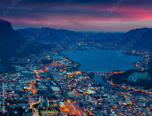 Night view of the city Lecco and Lake Garlate.