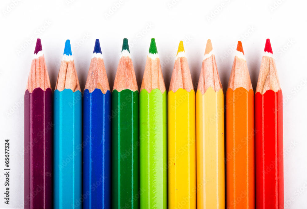 different colored pencils on white background different colored pencils on white background