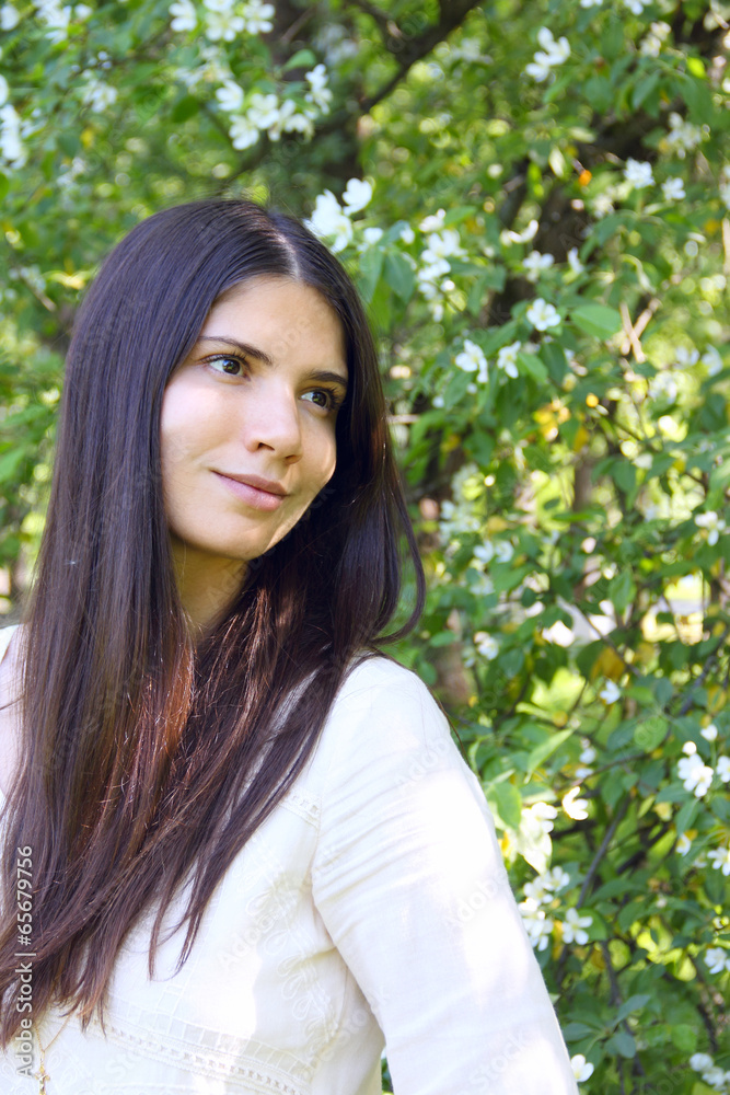 Young woman near apple tree Young woman near apple tree
