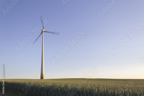 Wind turbine, motion blur, blue sky