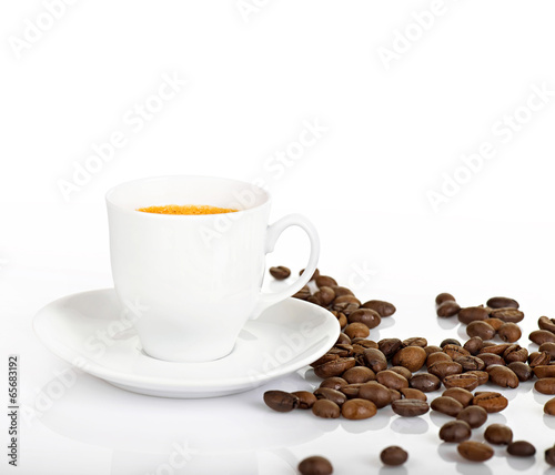Coffee cup and coffee beans on a white background