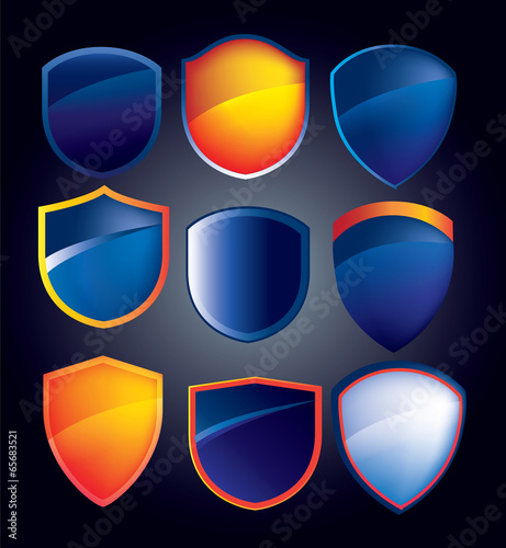 vector shield collection with glossy reflections in blue and ora