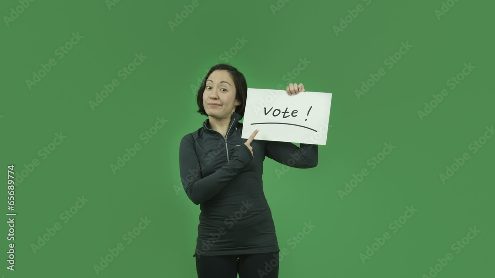 caucasian sporty girl isolated on green screen with vote sign