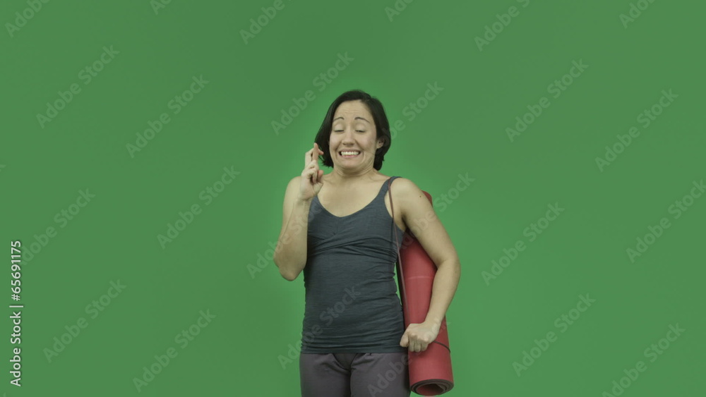 caucasian sporty girl with yoga mat isolated on green screen caucasian sporty girl with yoga mat isolated on green screen