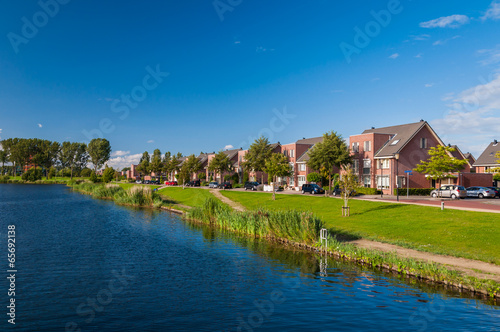 Peaceful quiet suburban with expensive houses on lake in Europe © Andrew