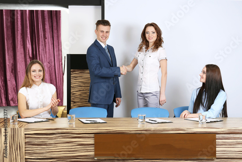 Business people at tribune ...