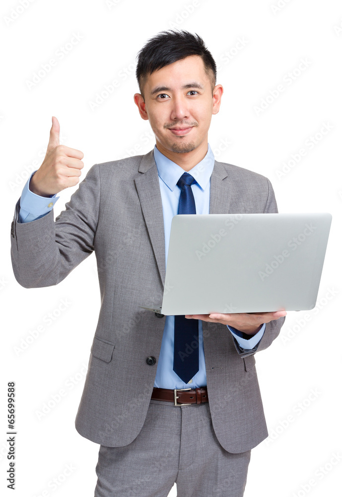 Businessman with laptop showing thumb up Businessman with laptop showing thumb up