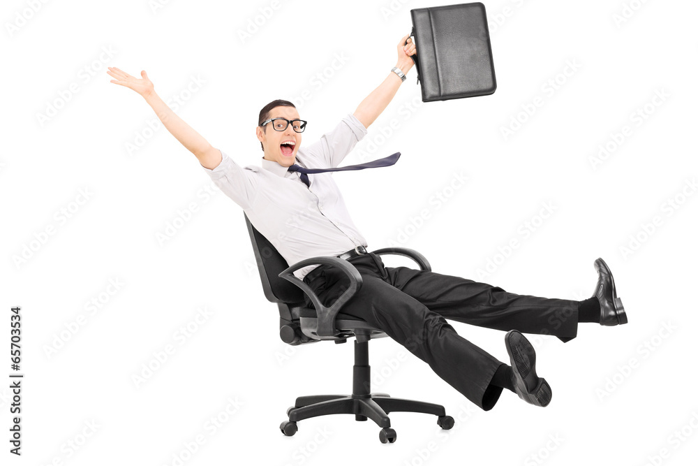 Overjoyed businessman riding in an office chair Overjoyed businessman riding in an office chair