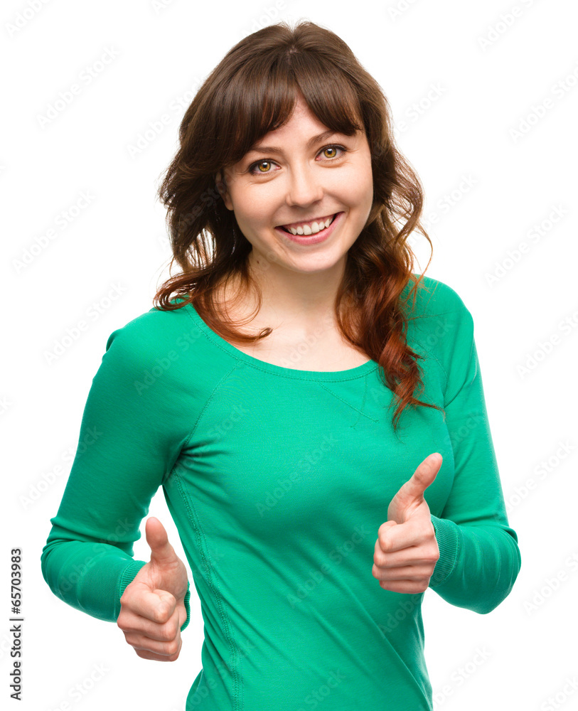 Woman is showing thumb up gesture Woman is showing thumb up gesture