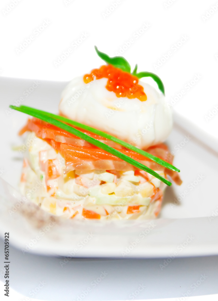 Salad with boiled vegetable, spicy salmon and egg on plate,