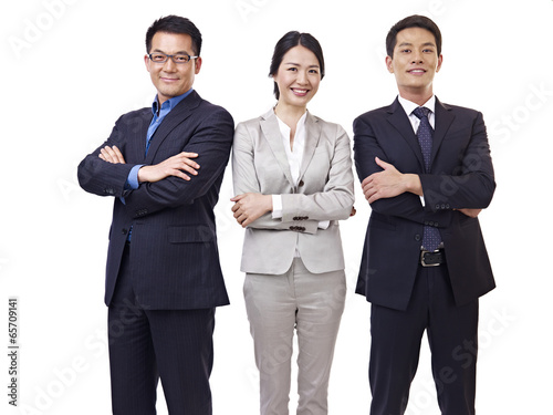 Photography studio portrait of asian business team isolated on white background