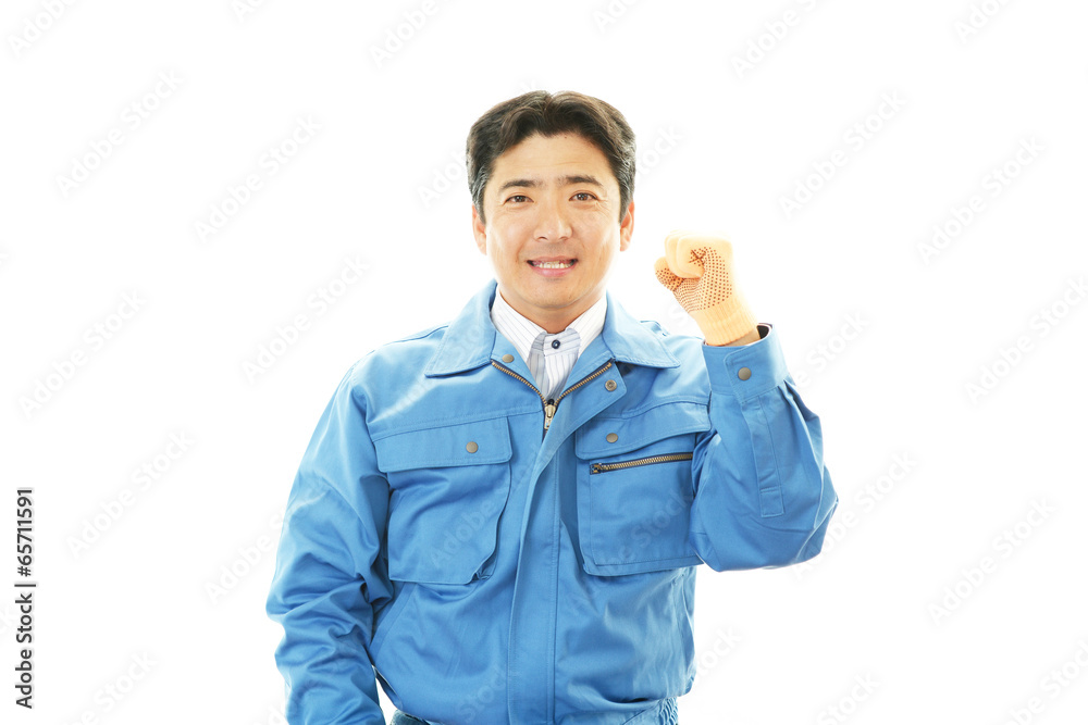 ガッツポーズの作業員