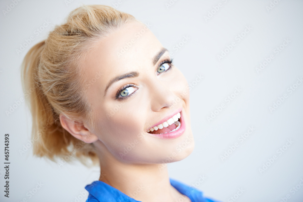 Pretty blond girl laughing at the camera Pretty blond girl laughing at the camera