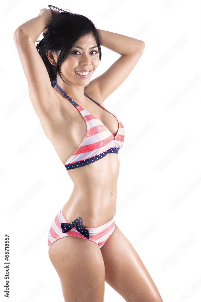 Fototapeta premium Pretty tanned woman in striped bikini 2