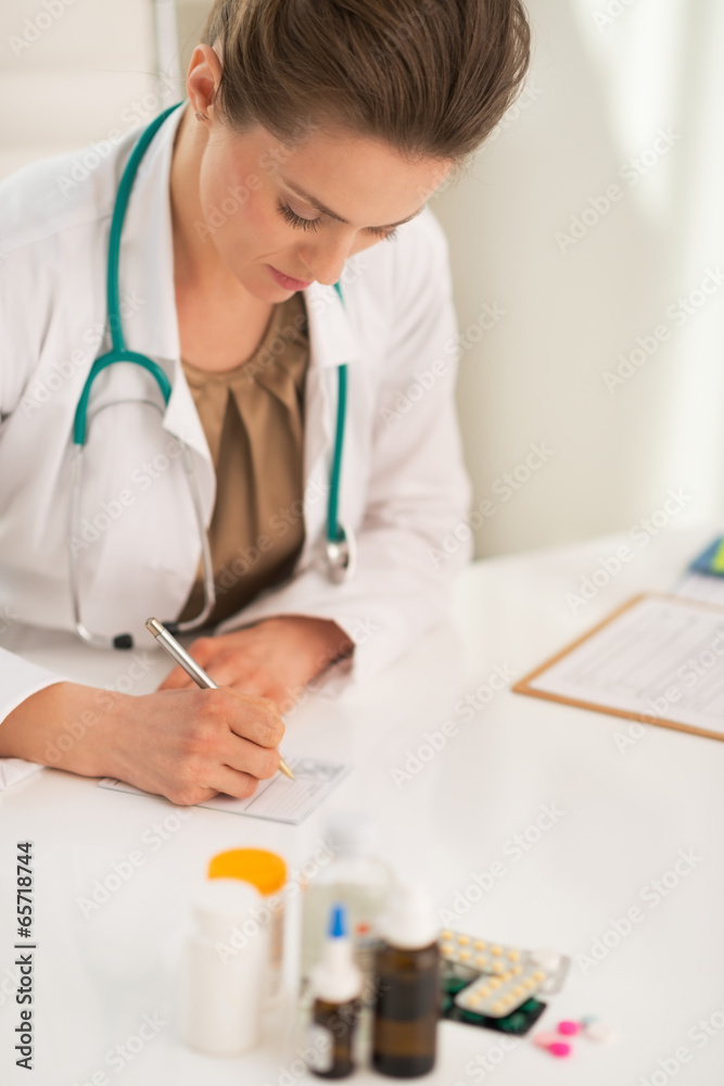 Medical doctor woman writing prescription Medical doctor woman writing prescription