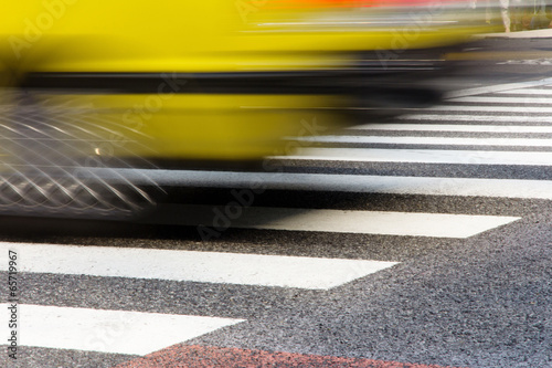 Taxi Speeding with zebra crossing in tokyo on motion