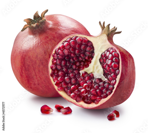 Whole, half and seeds of pomegranate isolated on white backgroun