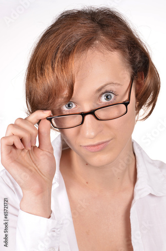 Surprised young woman in glasses