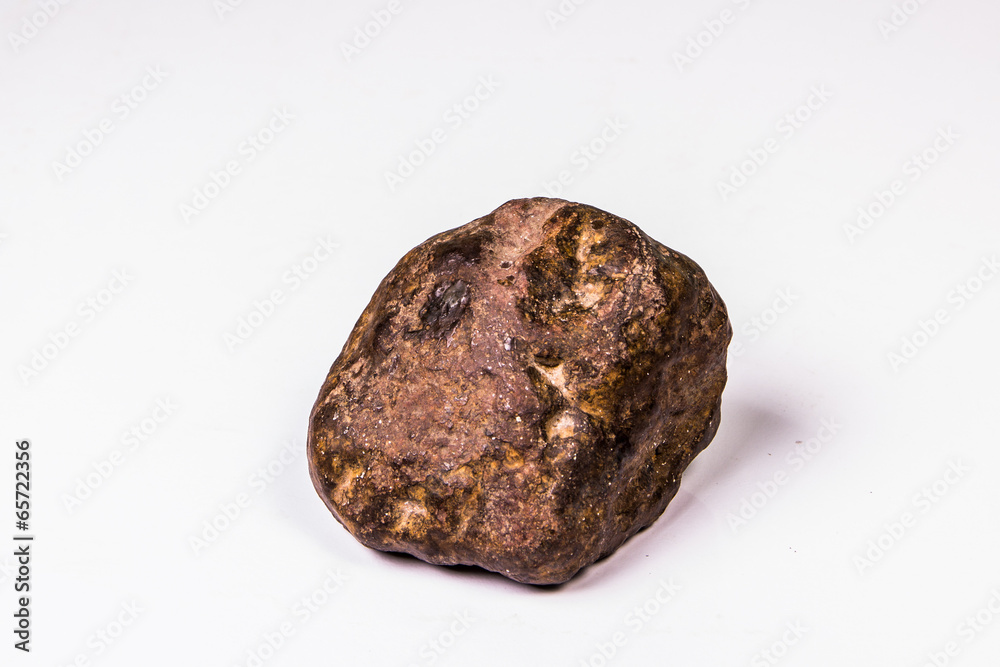 Large rock stone isolated on a white background. Large rock stone isolated on a white background.