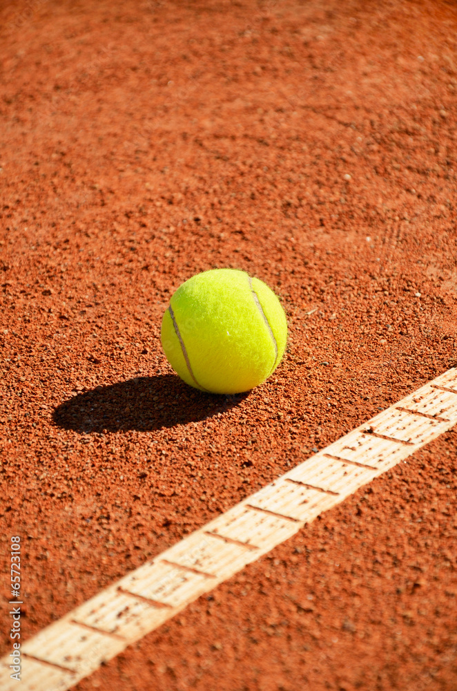 tennis ball near markup diagonal vertical