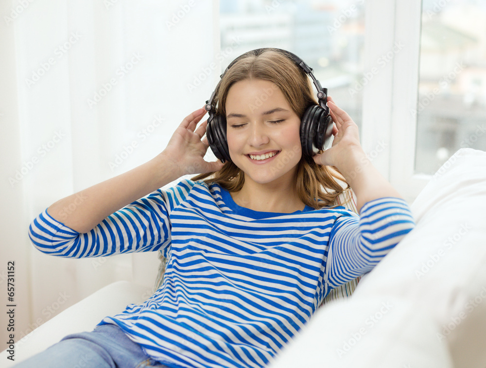 smiling young girl in headphones at home smiling young girl in headphones at home