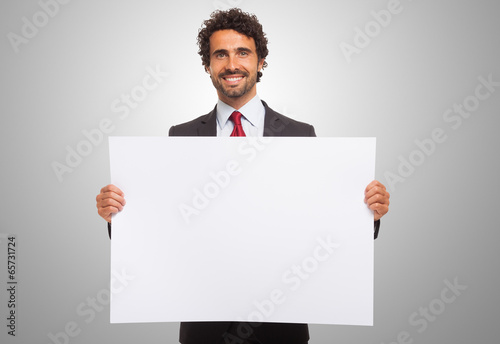 Man holding a blank board. photo