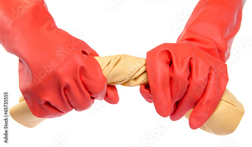 Hands in red rubber gloves wringing a cloth