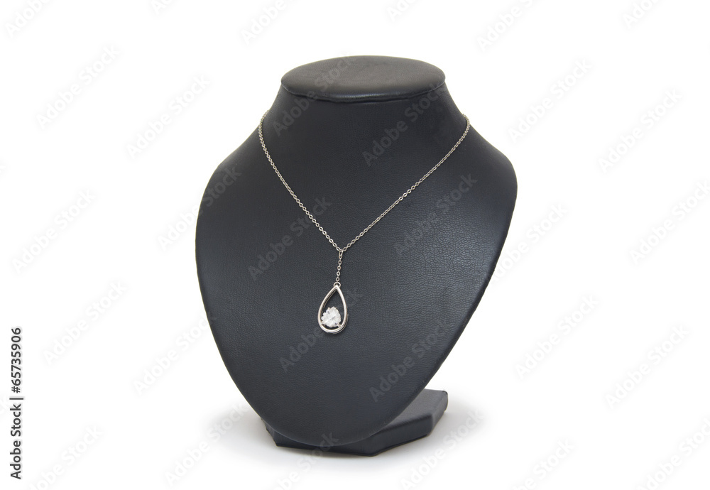 Diamond necklace on black mannequin isolated on white background Diamond necklace on black mannequin isolated on white background
