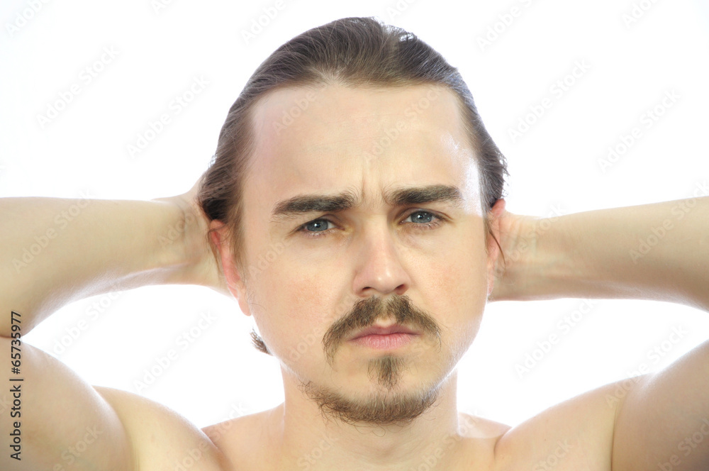 Obraz premium Attractive man with arms behind his head