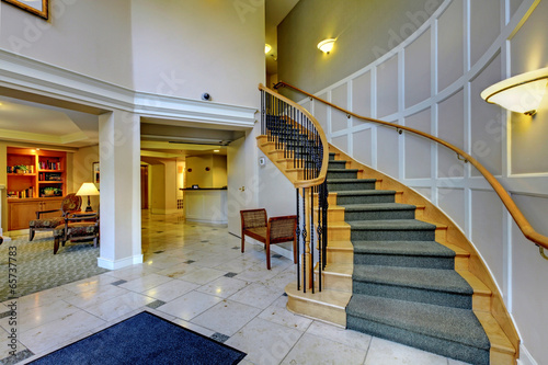 Hall with beautiful staircase and columns